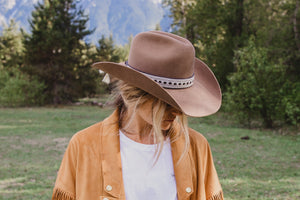 women wearing hat with wide high end hat band, brown reindeer leather, Simply Sami Jewelry, horsehair, Pemberton BC