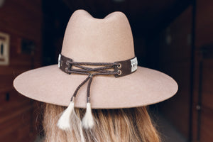 
                
                    Load image into Gallery viewer, back of hat, women wearing hat with wide high end hat band, brown reindeer leather, Simply Sami Jewelry, horsehair, Pemberton BC
                
            