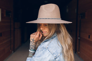 women wearing hat with thin high end hat band, brown reindeer leather, Simply Sami Jewelry, Pemberton BC