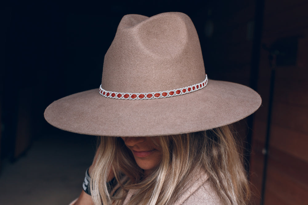 women wearing hat with thin high end hat band, tan reindeer leather, Simply Sami Jewelry, Pemberton BC