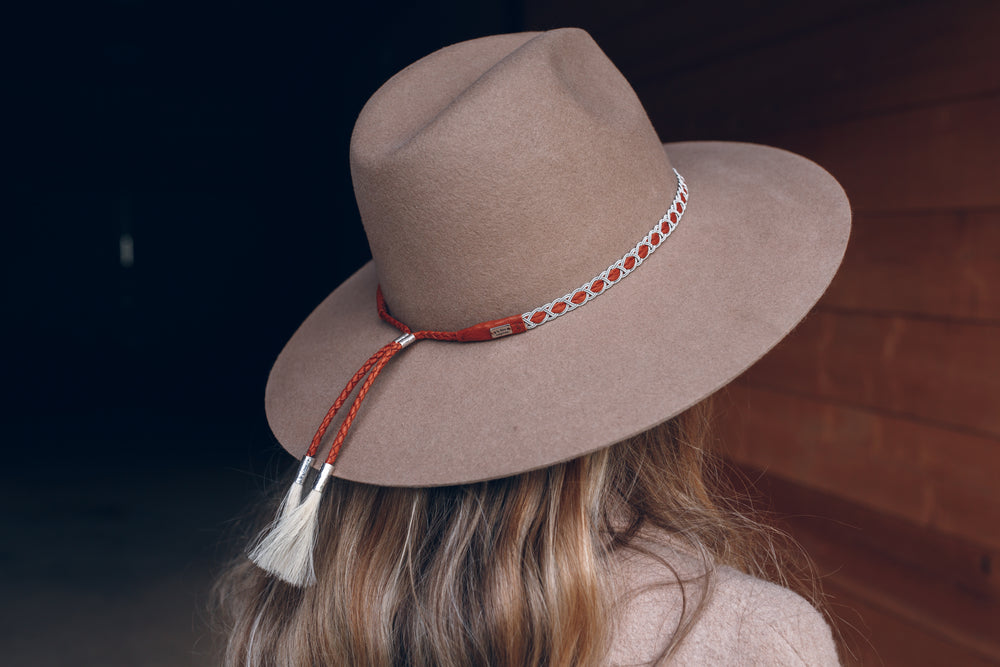 women wearing hat with thin high end hat band, tan reindeer leather, Simply Sami Jewelry, Pemberton BC