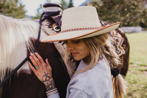 women wearing hat with thin high end hat band, tan reindeer leather, Simply Sami Jewelry, Pemberton BC