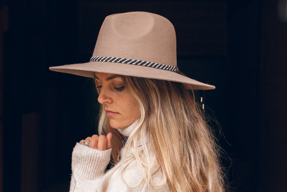 
                
                    Load image into Gallery viewer, women wearing hat with high end hat band, brown reindeer leather, Simply Sami Jewelry, Pemberton BC
                
            