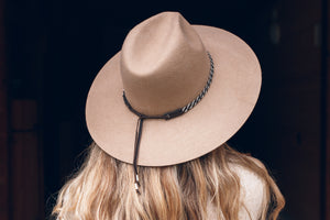 
                
                    Load image into Gallery viewer, women wearing hat with high end hat band, brown reindeer leather, Simply Sami Jewelry, Pemberton BC
                
            